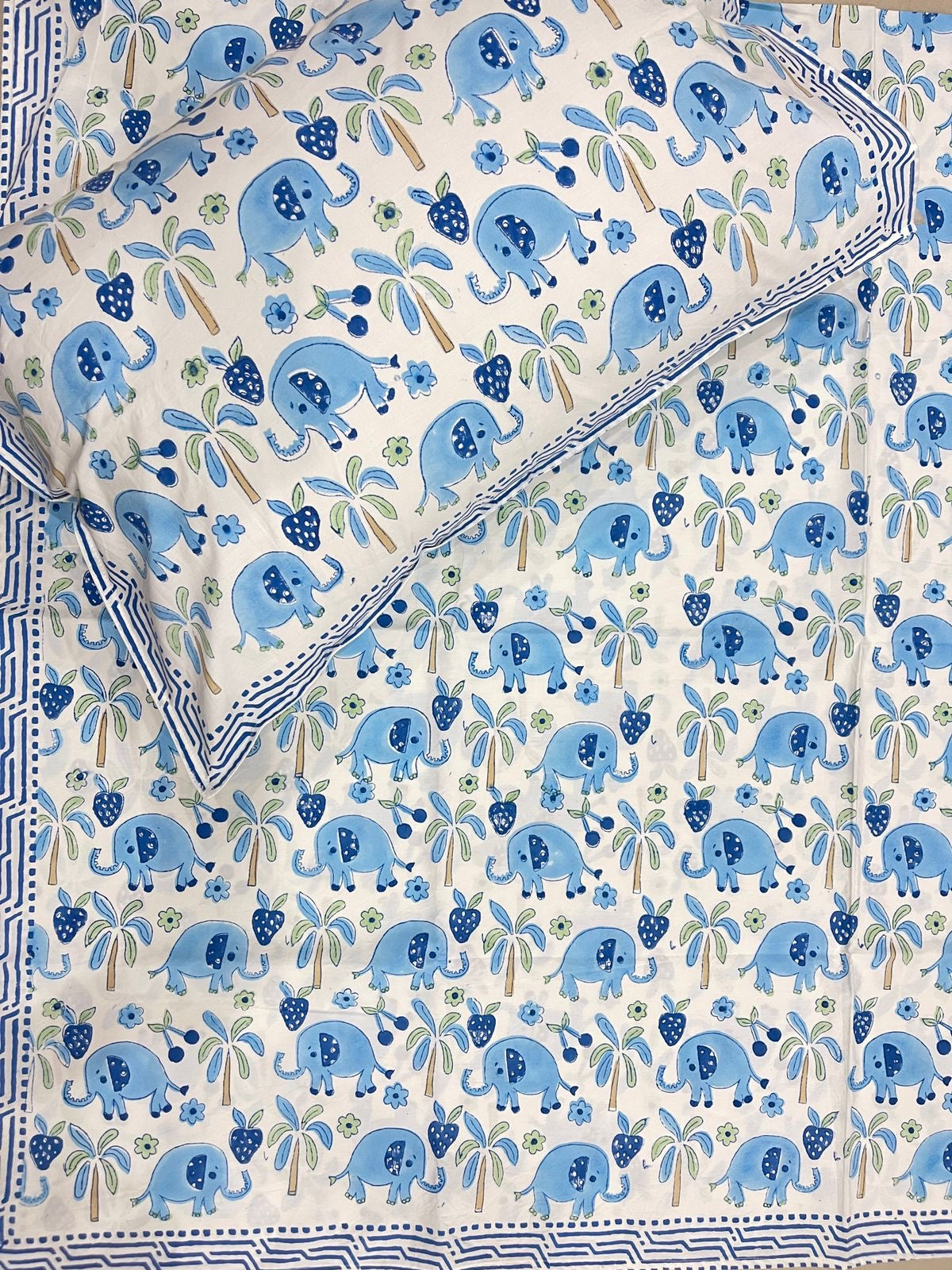 Patterned fabric with blue elephants and green leaves on a white background